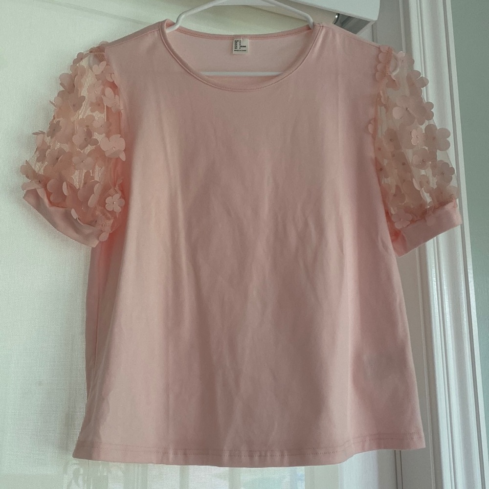 The funnest top with flower sleeves!